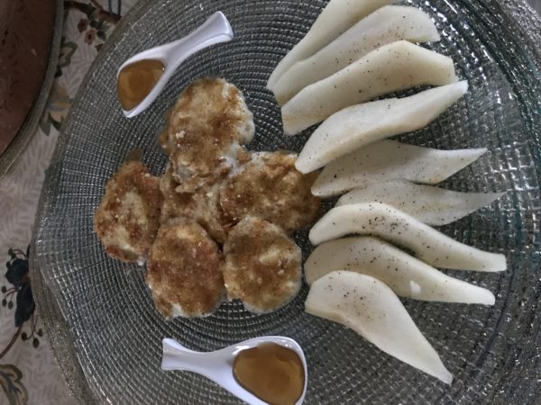 Fried Mozzarella on platter with pears and honey